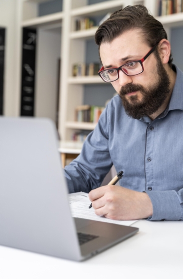 close-up-man-working-with-laptop